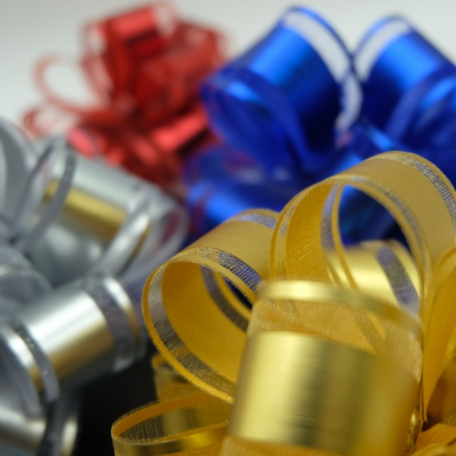 Soft gauze pom bows with delicate texture for elegant gift decoration.