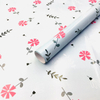 Premium glossy art paper featuring vibrant five-color floral patterns for elegant gift wrapping.