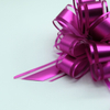 Soft gauze pom bows with delicate texture for elegant gift decoration.