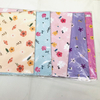 Premium glossy art paper featuring vibrant five-color floral patterns for elegant gift wrapping.