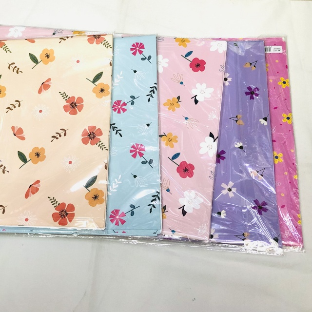 Premium glossy art paper featuring vibrant five-color floral patterns for elegant gift wrapping.