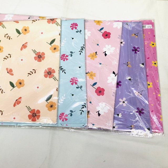 Premium glossy art paper featuring vibrant five-color floral patterns for elegant gift wrapping.