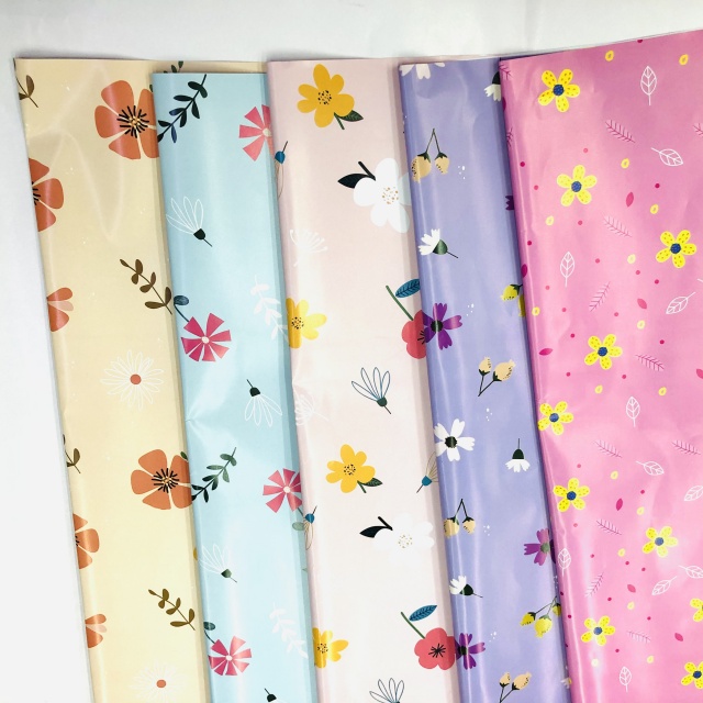 Premium glossy art paper featuring vibrant five-color floral patterns for elegant gift wrapping.
