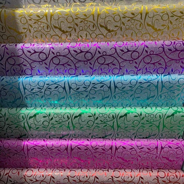 Sparkling Glitter Paper Paired with Coordinated Ribbons in Elegant Sets. Perfect for Creating Dazzling Gift Presentations Effortlessly.