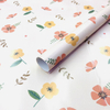 Premium glossy art paper featuring vibrant five-color floral patterns for elegant gift wrapping.