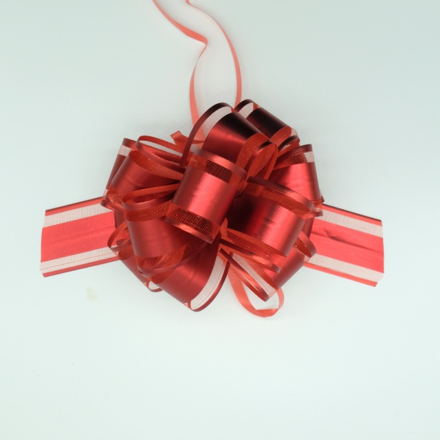 Soft gauze pom bows with delicate texture for elegant gift decoration.