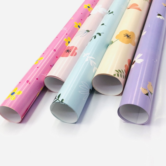 Premium glossy art paper featuring vibrant five-color floral patterns for elegant gift wrapping.