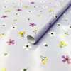 Premium glossy art paper featuring vibrant five-color floral patterns for elegant gift wrapping.