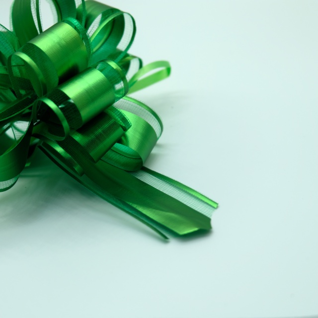 Soft gauze pom bows with delicate texture for elegant gift decoration.