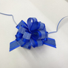 Dimensional Striped Double-layer Pom Bows for Luxurious Gift Presentations.